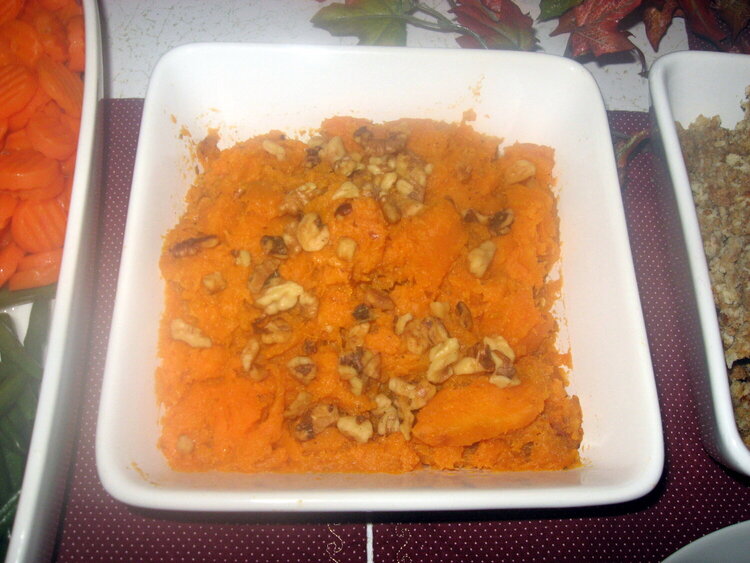 Bourbon Roasted Sweet potatoes with nutmeg, cinnamon, and topped with walnuts