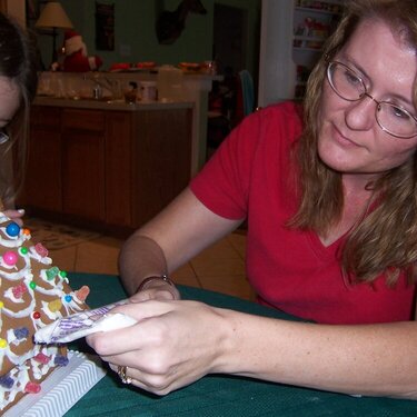 Mom and gingerbread house