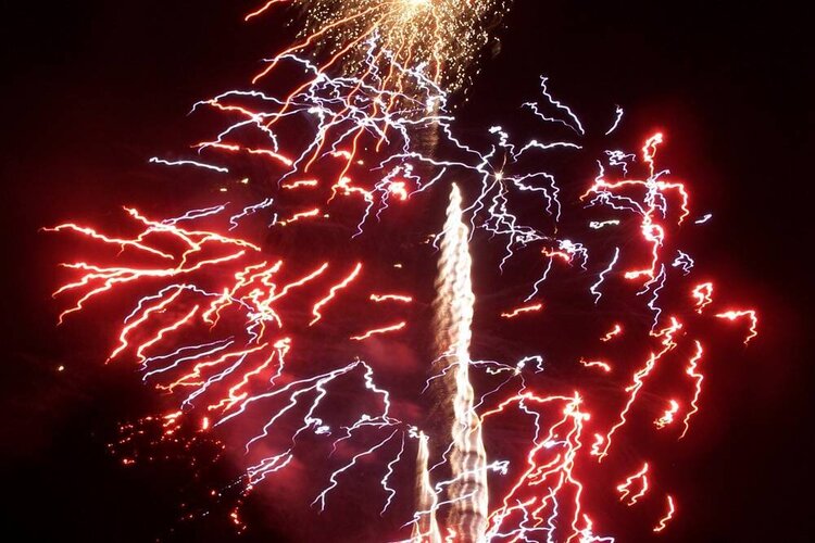 Washington Monument surrounded by fireworks