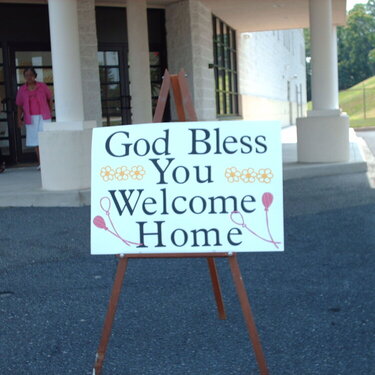 Welcome Home in front of Church