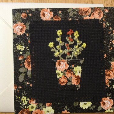 Embroidered flowers on faux leather