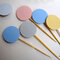 Flower shaped cupcake toppers in soft pastel colors
