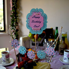 A birthday sign and birthday cake bunting