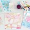 Julie Comstock had fun with the new Cosmo Cricket Watercolor Paper Collection