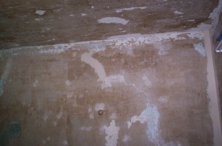 West wall showing earlier repairs and cracks