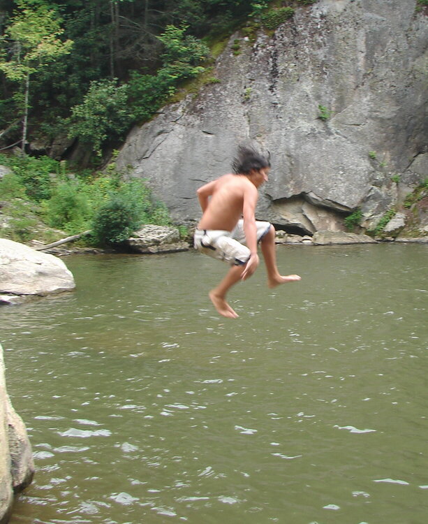 Mid air before his body hit the cold water