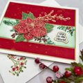 Christmas card with "perfect poinsettias stamps by Simon Hurley".