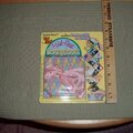 Fold out novelty scrapbook - folds up to 4 x 4 has pink ribbon