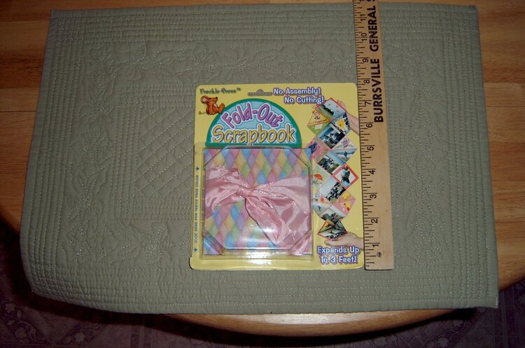 Fold out novelty scrapbook - folds up to 4 x 4 has pink ribbon