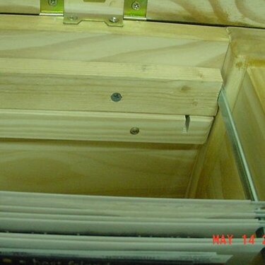 Close up view of the metal slat holding folders