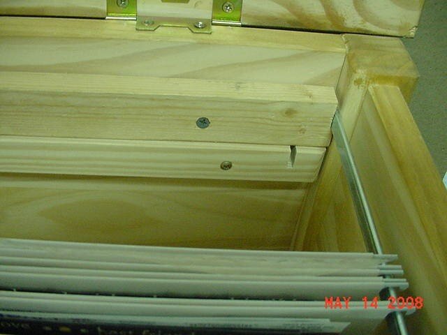 Close up view of the metal slat holding folders