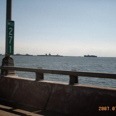 the naval ships getting worked on in the bay