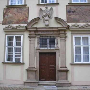 The door in municipality couryard with fresco