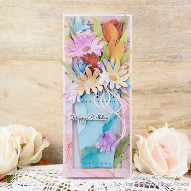 A birthday card with a bouquet in a vase