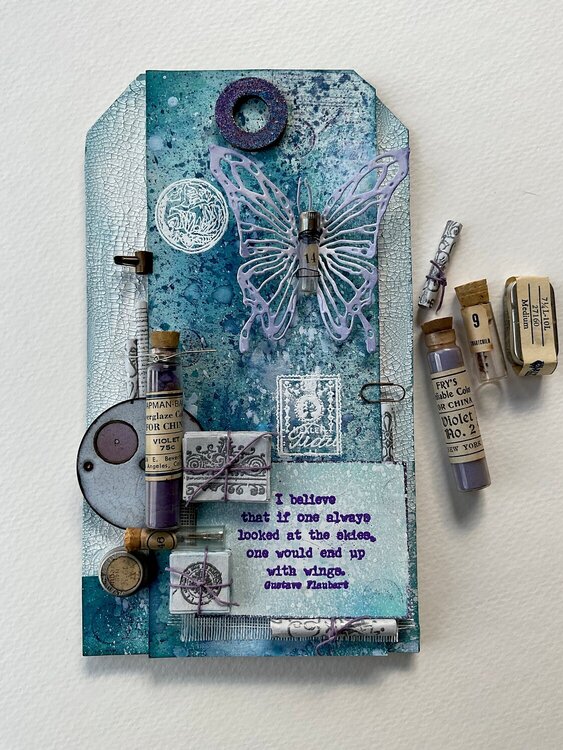Mixed media tag with pocket watch parts. 