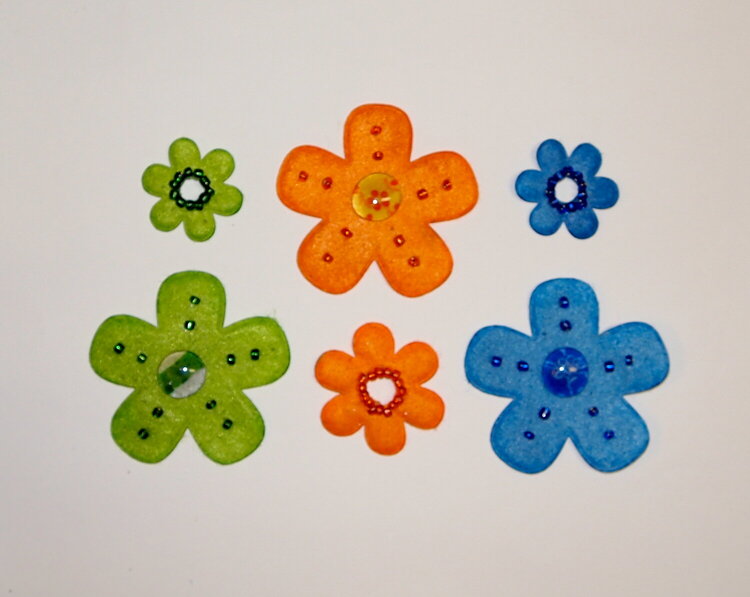 Felt, bead, and pebble flowers