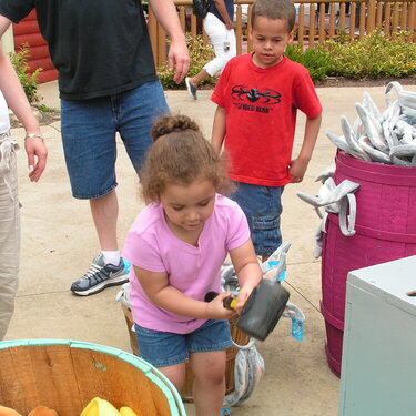 my niece playing a game at six flags