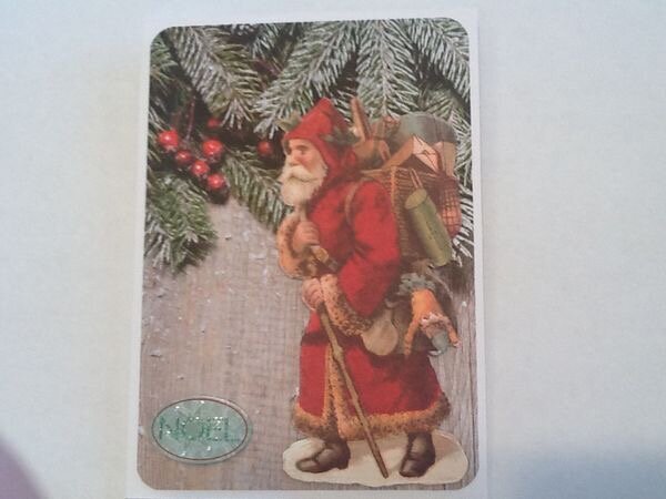 This is one of my husbands cards I created he love the look of the old fashion St. Nick.