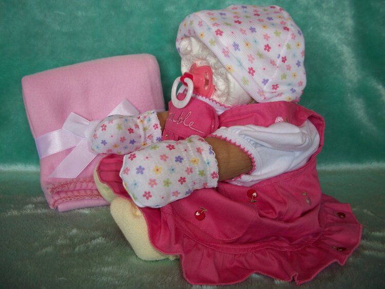 diaper baby girl in dress side view