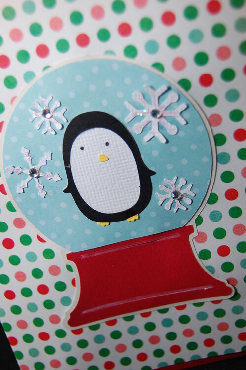 Close up of Penguin Snowglobe Christmas card