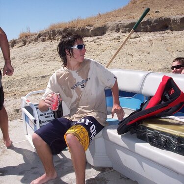 Cody &amp; Matt peekin over side of boat