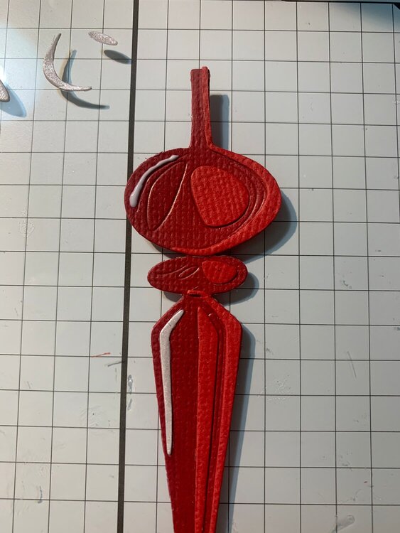 Red ornament with cut 3 almost complete