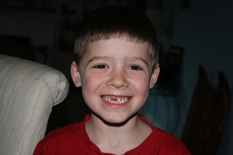 3/30  Joey lost his first tooth!!