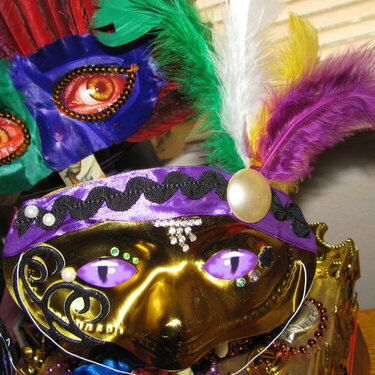 Mardis Gras masks gold and feather