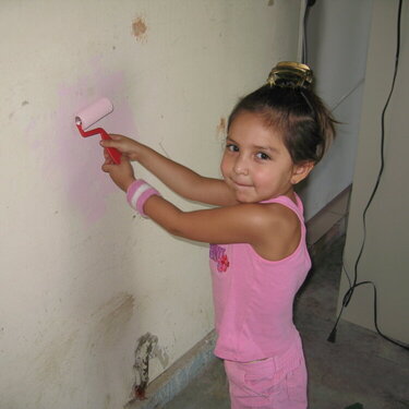 Victoria and her very own paint roller.