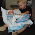 Luke holds Charlie for the first time