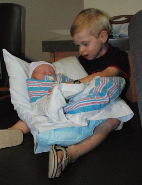 Luke holds Charlie for the first time