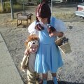 Dorothy and the Cowardly Lion with Toto in the basket