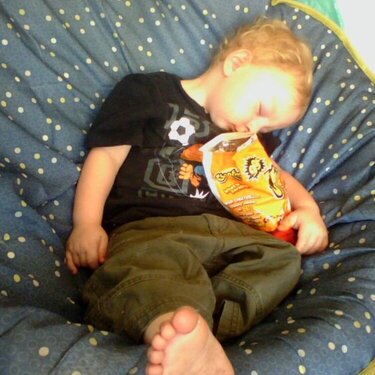 Dean fast asleep with his Cheetos
