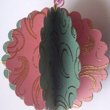 Pink and green holiday ornament