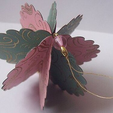 Pink and green holiday ornament-top view