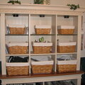 My curio with baskets