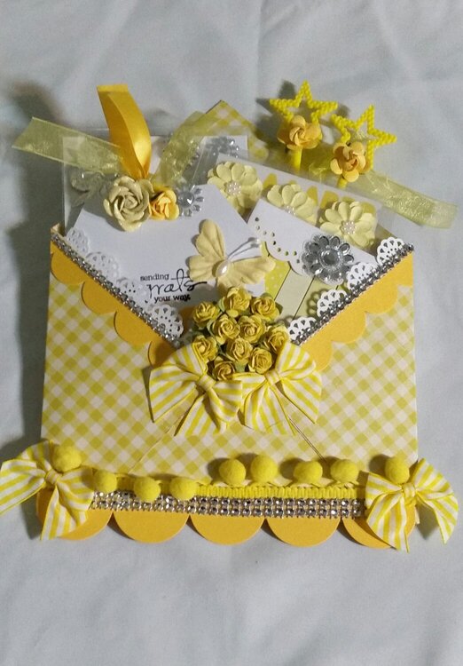 Yellow loaded envelope by Monique Fox