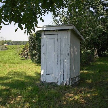 #6 -  A wooden outhouse
