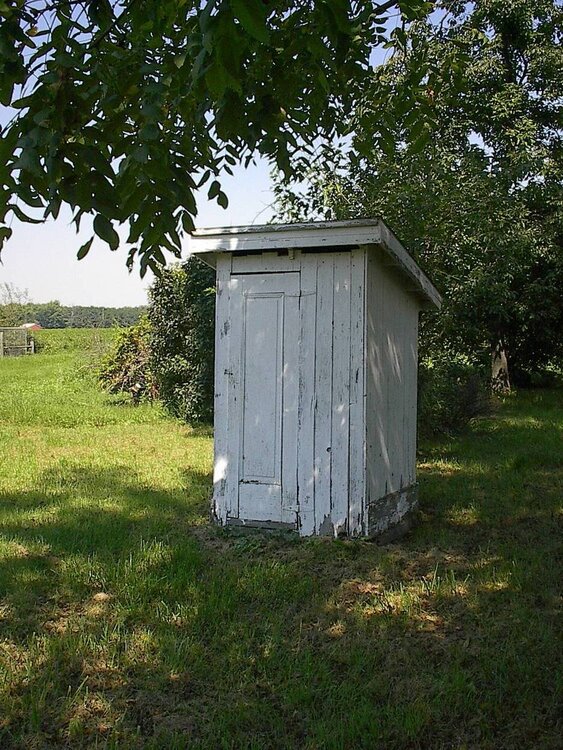 #6 -  A wooden outhouse