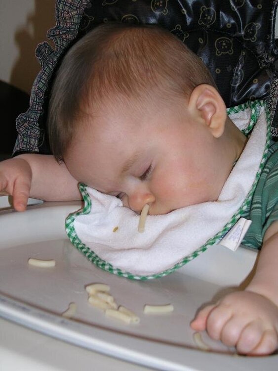 asleep in his high chair