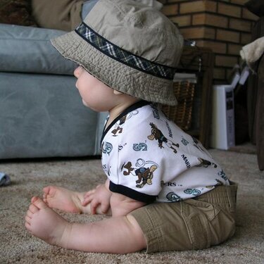 So cute in his sun hat