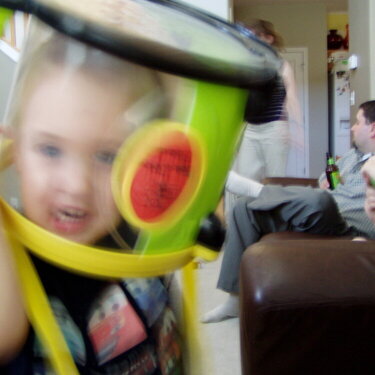 Bryce, one of  the twins, putting a Drum on his head like a helmet!
