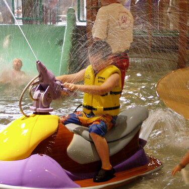 My Grandson, Brett ,on a ride in the Water Park