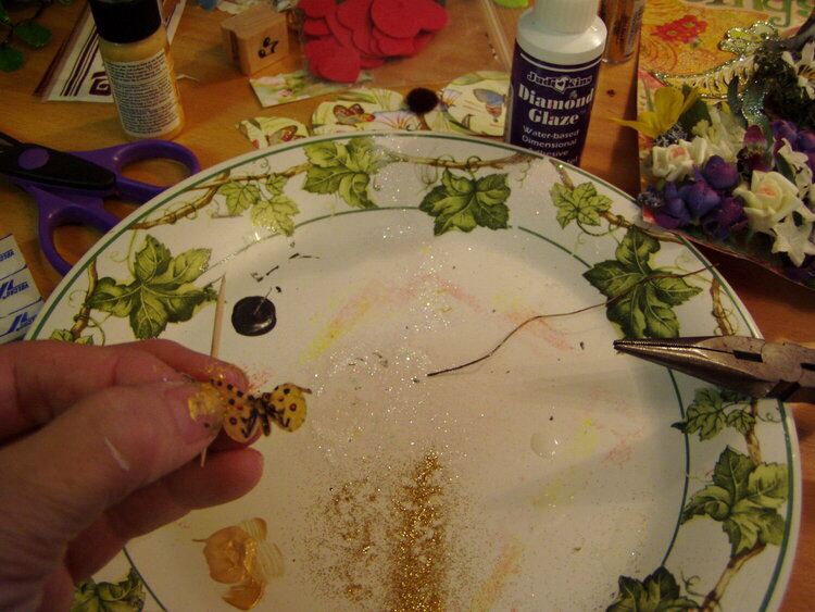 Adding glimmer to the Vellum cut out Butterflies