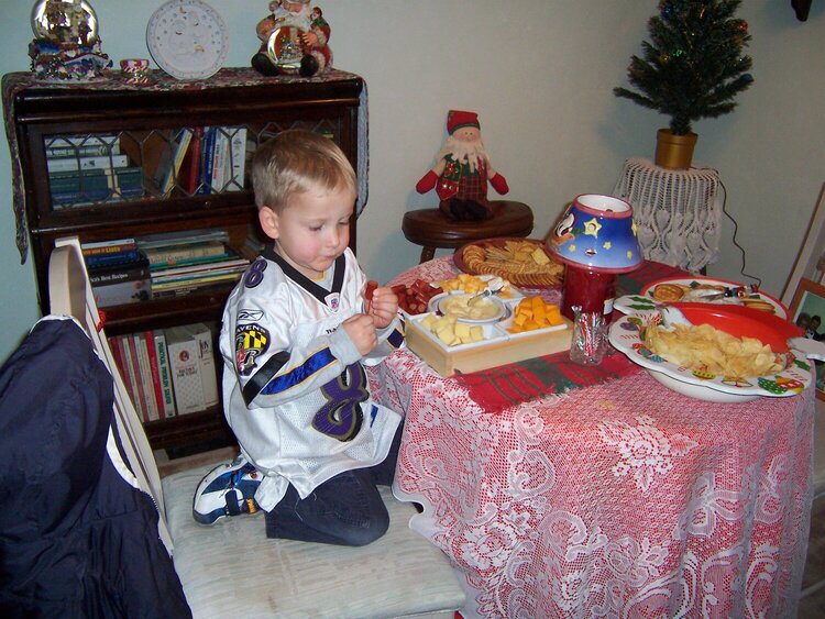 grandson eating a snack christmas eve