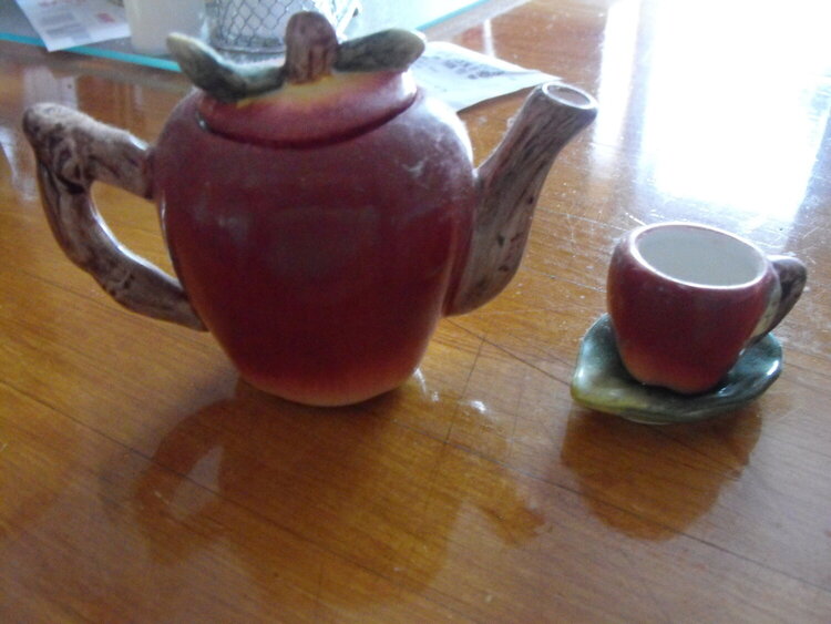 apple tea pot and cup and saucer