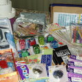 Punches, chipboard, letter stickers and charms, glue gun, fibers, photo mounts, stencils, metal embellies, etc.