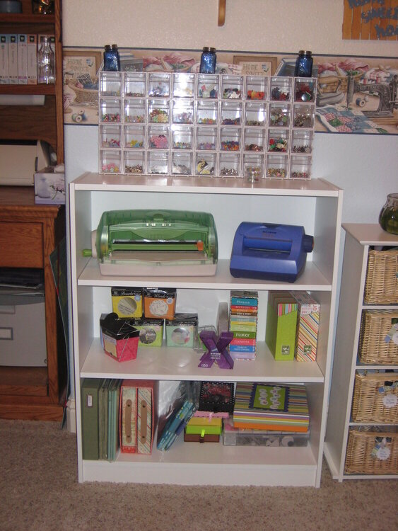 My adhesive/brad book shelf.
