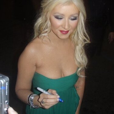 Christina Agularia autographing my Mini book  Nov 15th at  the Red carpet Premiere  of Burlesque