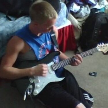 Jonathon teaching himself guitar....